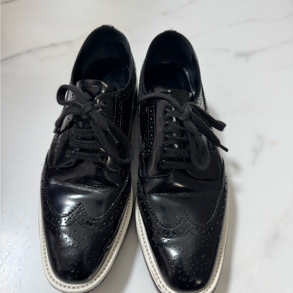 Prada Black and White Brogue Sneakers
